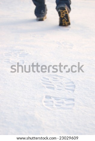 Fresh tracks from man boots on clean snow