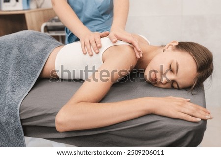 Image, Stock Photo Young woman lies on a bale of straw in the field and smiles