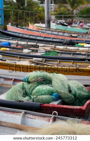 A group of traditional fishing boats parked in El Salvador, Puerto de la Libertad\'s harbor