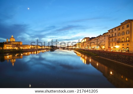 The Arno River sunset panorama with moon reflection in water, Florence, Tuscany, Italy.