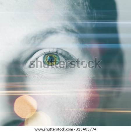 Double exposure effect of the motion night city lights with bokeh and man green eye with color and monochrome parts