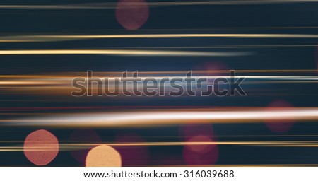 Abstract blurred motion light of the night city auto trafic with bokeh