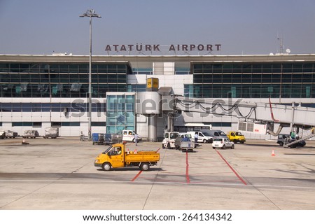 Istanbul, Turkey - October 11, 2009: Airport workers and cars on Ataturk international Airport
