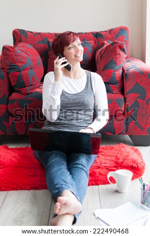 Attractive female professional working from a contemporary home