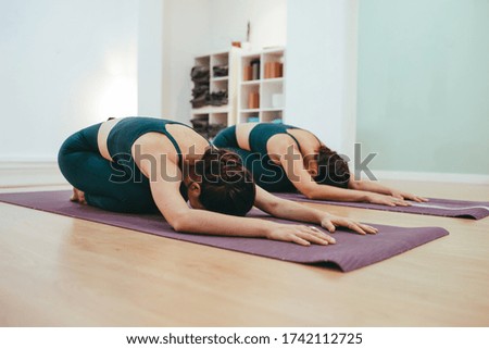 Similar – Image, Stock Photo Yoga girls doing Anahatasana pose. Cenital Plane