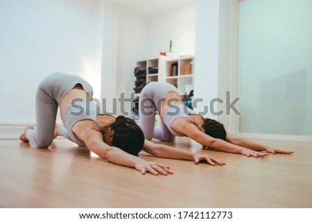 Image, Stock Photo Yoga girls doing Anahatasana pose. Cenital Plane