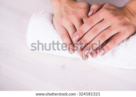 Manicure - Beauty treatment photo of nice manicured woman fingernails.