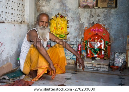 PUSHKAR, INDIA- FEBRUARY 16 2015: Unidentified sadhu in meditation. Sadhu is a religious ascetic who is solely dedicated to achieving liberation from the world through meditation and contemplation.