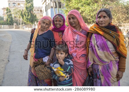PUSHKAR, INDIA - FEBRUARY 17: An unidentified beautiful group of Indian lady smile to tourist at Pushkar Town on February 17, 2015 in Pushkar, Rajasthan, India. with theirtypical colored dress