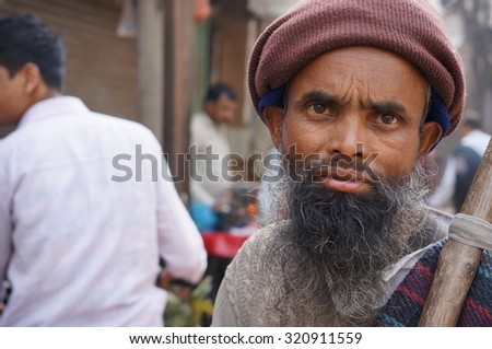 OLD DELHI, INDIA, FEB 15 : An undentified of old man at street of Chandni Chowk, Old Delhi, India in his routine activity on February 15, 2015.