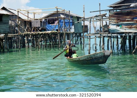 OMADAL ISLAND, SABAH, MALAYSIA - MAY 10 : Unidentified Sea Gypsies people on May 10, 2015 in Sabah, Malaysia. The Sea Gypsies are sea nomads that move from one place to another.