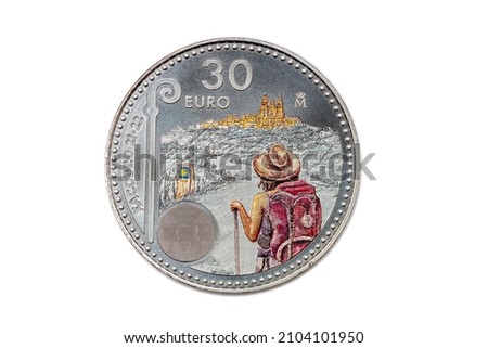 reverse of the silver coin from Spain of 30 euros of the year 2021 showing a scene of the Way of St James (Camino de Santiago) on a white background Imagine de stoc © 