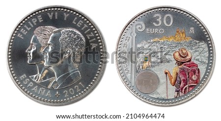 Obverse and reverse of the silver coin from Spain of 30 euros of the year 2021 showing a scene of the Way of St James (Camino de Santiago) on a white background with the portrait of Felipe VI the King Imagine de stoc © 
