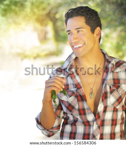 Great looking male model with nice big smile outdoors
