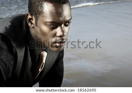 man in suit on the ocean