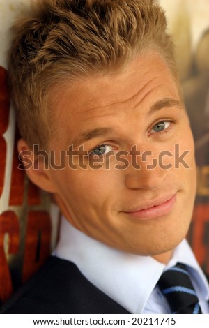 Close-up portrait of young male model with slight smile