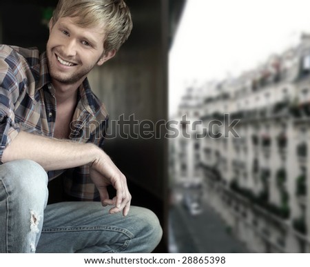 Portrait of a happy young man on rooftop