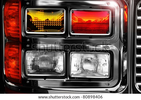 Detail of a shiny new headlamps on firetruck