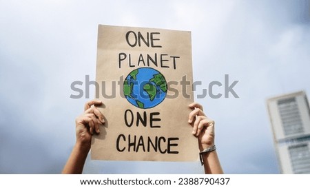 Similar – Image, Stock Photo Woman holding sign on which poverty is written