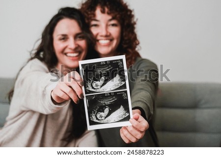 Similar – Image, Stock Photo Loving couple of lesbians hugging on street