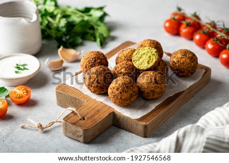 falafel balls on a wooden cutting board, selective focus