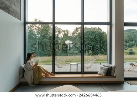 Similar – Image, Stock Photo Woman sitting at home with cat