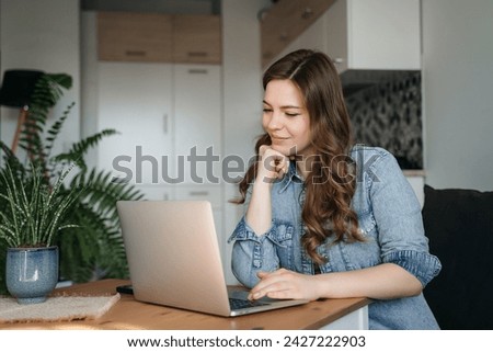 Similar – Image, Stock Photo Relaxed woman using laptop while resting on deck chair