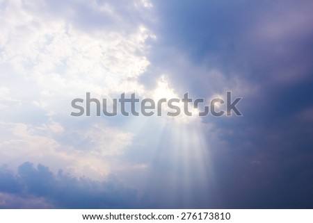 sun rays through cloudy sky, hope symbol