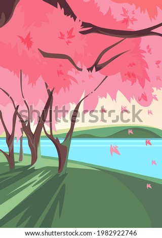 Blooming sakura on river bank. Nature landscape in vertical orientation.