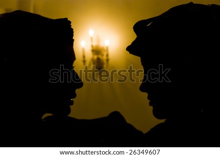 Two beauty silhouette of face to face girls