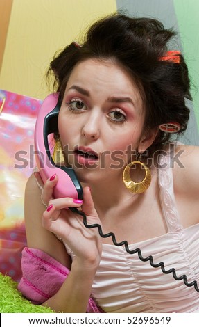 beauty girl pink phone call on color wall background
