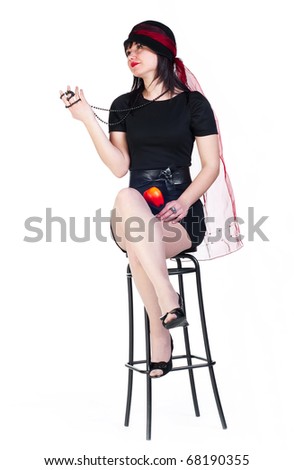 beauty girl in black dress sit on a bar stool