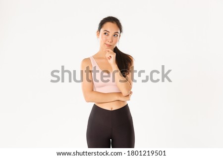 Similar – Image, Stock Photo Thoughtful young female athlete listening to music in studio