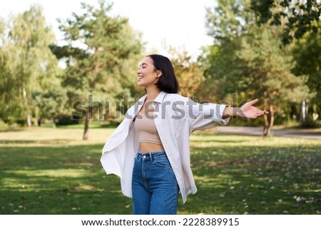 Similar – Image, Stock Photo Satisfied Asian woman on vacation during excursion