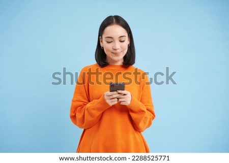 Similar – Image, Stock Photo Woman texting on smartphone while walking on sidewalk