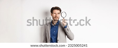 Image, Stock Photo Man with magnifying glass searches for the ideal employee