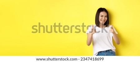 Similar – Image, Stock Photo A young woman says goodbye to an incredibly cuddly house cat. The cat enjoys the caresses in the sun on the stairs.