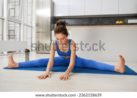 Similar – Image, Stock Photo Focused young sportswoman doing exercise with weight at home