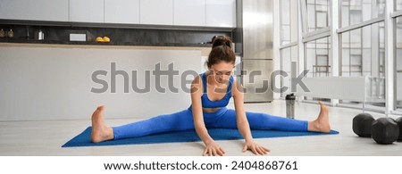 Similar – Image, Stock Photo Focused young sportswoman doing exercise with weight at home