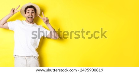 Similar – Image, Stock Photo Male tourist with photo camera standing on rocky lake shore