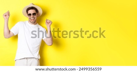 Similar – Image, Stock Photo Tourist with straw hat in rear view photographs a sailing ship in Brittany at the sea between rocks