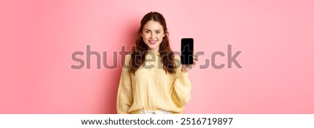 Similar – Image, Stock Photo Young smiling cheerful pleased woman indoors at home kitchen using social media on mobile phone for chatting and staying connected with her loved ones. Stay at home, social distancing lifestyle.