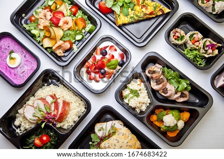 Catering food with healthy balanced diet delicious lunch box boxed take away deliver packed ready  meal in black container dinner, meal, brakfast ストックフォト © 