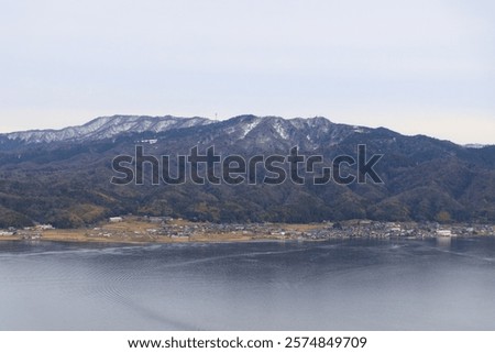 Similar – Image, Stock Photo Calm sea near hill under cloudy sky in foggy weather