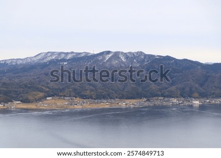 Similar – Image, Stock Photo Calm sea near hill under cloudy sky in foggy weather