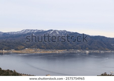 Similar – Image, Stock Photo Calm sea near hill under cloudy sky in foggy weather