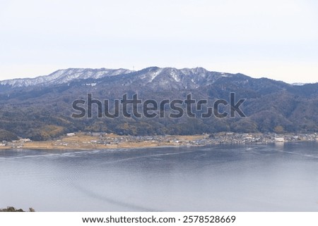 Similar – Image, Stock Photo Calm sea near hill under cloudy sky in foggy weather