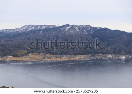 Similar – Image, Stock Photo Calm sea near hill under cloudy sky in foggy weather