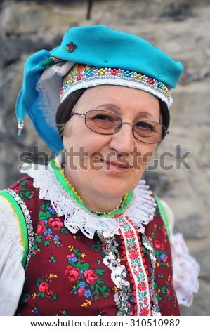 HOLLOKO, HUNGARY - APRIL 13 : Women in folk costume in the village during the traditional Easter Festival at April 13, 2009 in Holloko, Hungary. Village is UNESCO World Heritage Site