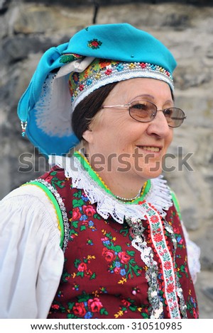 HOLLOKO, HUNGARY - APRIL 13 : Women in folk costume in the village during the traditional Easter Festival at April 13, 2009 in Holloko, Hungary. Village is UNESCO World Heritage Site
